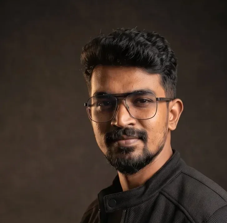 Three-quarter close studio portrait of the Ather Three-quarter close studio portrait of the AtherFlow founder in a black jacket, AtherFlow Chennai
