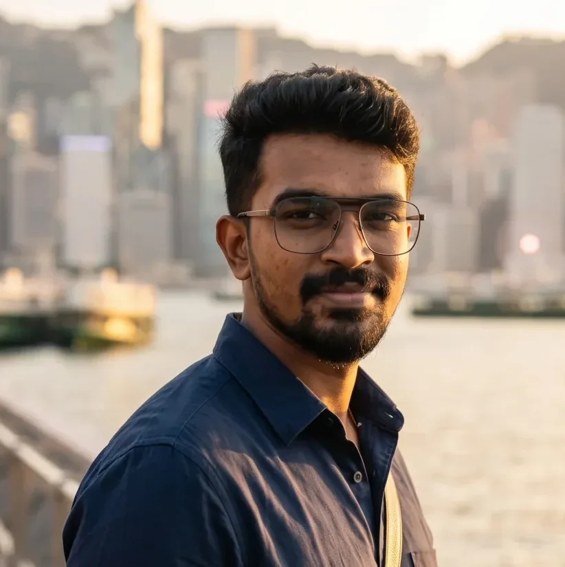Close portrait of the founder on the Hong Kong harbour promenade with the skyline softly blurred